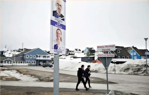  ?? (Christian Klindt Soelbeck/Ritzau Scanpix via Reuters) ?? ELECTION POSTERS for Greenlandi­c County Council elections are seen in Nuuk, Greenland, last week. Chinese interest in Greenland comes after Beijing laid out its ambitions to form a ‘Polar Silk Road’ by developing shipping lanes opened up by global...