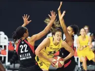  ?? Chris O’Meara / Associated Press ?? Seattle Storm forward Breanna Stewart (30) gets between Las Vegas Aces center A’ja Wilson (22) and forward Cierra Burdick (11) during the second half of Game 3 of the WNBA Finals in October.