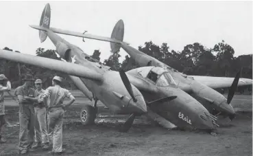  ??  ?? P-38H-5-LO Lightning#88 Elsie of the 9th Fighter Squadron 49th Fighter Group 5th AF after landing with battle damage at Dobodura, New Guinea, fall of 1943. (Photo courtesy of Jack Cook)