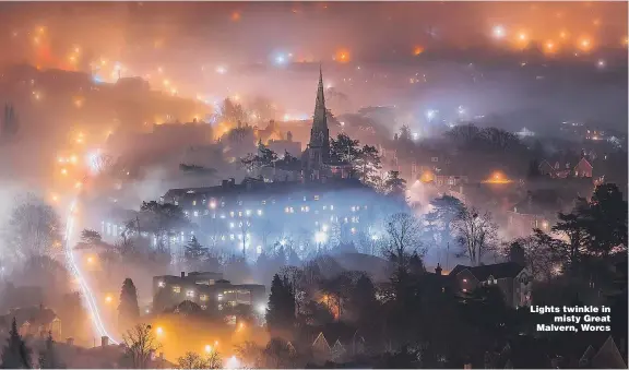  ?? Picture: JAN SEDLACEK/ SWNS ?? Lights twinkle in misty Great Malvern, Worcs