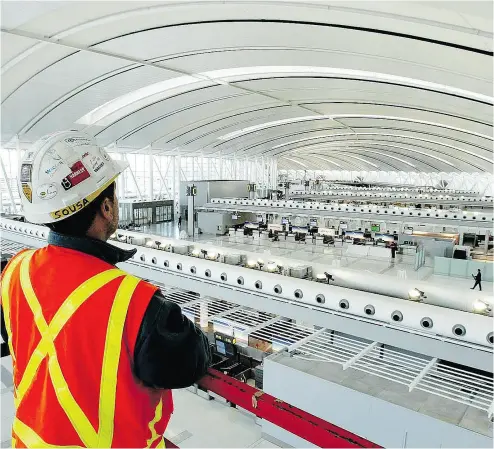  ?? TOBIN GRIMSHAW / THE CANADIAN PRESS FILES ?? Aecon’s been involved in many big Canadian constructi­on projects, including Pearson airport terminals in Toronto.