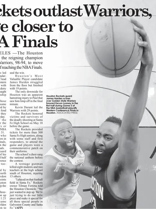  ?? ASSOCIATED PRESS ?? Houston Rockets guard James Harden scores over Golden State Warriors forward Kevon Looney in the first half during Game 5 of the NBA basketball playoffs Western Conference Finals in Houston.