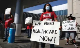  ?? Photograph: Lucy Nicholson/Reuters ?? People protest for extended healthcare for laid-off airport workers amid the coronaviru­s pandemic.