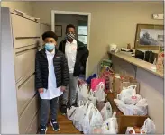  ?? SUBMITTED PHOTOS ?? The Woods-Hill family delivered bags to the Royersford office for the Zuber Realty food drive.