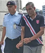  ?? Photo: Ashna Kumar ?? Sanjay Lakhna is escorted by a Police officer at the Suva courthouse on July 13, 2020.
