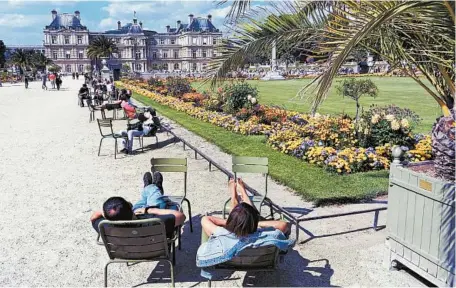  ?? PHOTO BY RICK STEVES ?? Parisians and tourists practice artful relaxation in the oasis of Luxembourg Gardens, just one of the many places bursting with colors across Europe.
