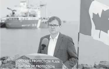  ?? ADRIAN LAM, TIMES COLONIST ?? Fisheries and Oceans Minister Jonathan Wilkinson announces upgrades to oil-response equipment at the Canadian Coast Guard station in James Bay on Sept. 7, part of the $1.5-billion Ocean Protection Plan.