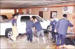  ?? KFSD photo ?? Fire department employees try to pump out water collected in a basement in one of the
buildings. KFSD is on alert until weather conditions stabilize in the country.