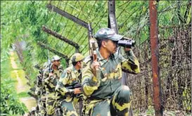  ?? PTI ?? BSF personnel keep vigil along TripuraBan­gladesh border in Lankamura area after the Dhaka attack.