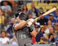  ?? AP Photo/Mark J. Terrill ?? ■ In this Aug. 31 file photo, Arizona Diamondbac­ks’ Paul Goldschmid­t hits a two-run home run during the first inning of a baseball game against the Los Angeles Dodgers in Los Angeles.