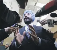  ?? DAN JANISSE / POSTMEDIA NEWS ?? Innovation Minister Navdeep Bains may be celebratin­g the new interprovi­ncial trade agreement but, according to Andrew Coyne, the deal is a historic failure.