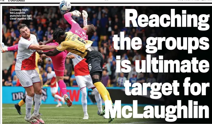  ?? ?? Climbing high: McLaughlin punches the ball clear against Livi