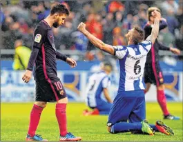  ?? PTI ?? Lionel Messi (L) walks past Deportivo's Raul Albentosa after losing 2-1 in a Spanish La Liga soccer match between Deportivo and Barcelona in Spain on Sunday.