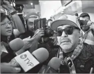  ?? HENRY ROMERO / REUTERS ?? Argentine soccer legend Diego Maradona, new head coach of Mexican second division team Dorados, is greeted by fans and media upon his arrival at the airport in Culiacan, Mexico, on Saturday.