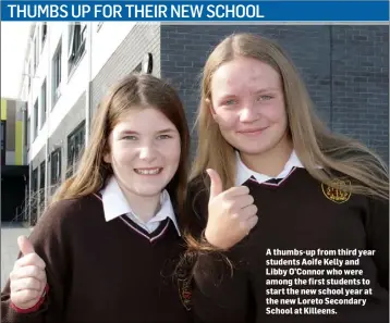  ??  ?? A thumbs-up from third year students Aoife Kelly and Libby O’Connor who were among the first students to start the new school year at the new Loreto Secondary School at Killeens.
