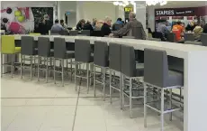  ??  ?? A row of seats sit empty at the Park Royal South food court. Chess players have been told they can no longer play at the mall.