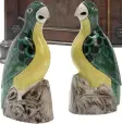  ??  ?? ABOVE FROM LEFT The winning bid on a pair of antique Chinese porcelain parrots was £1,750; a late 18th- century serpentine commode was not in perfect condition but still fetched £17,500; a set of seven late 1700s giltwood armchairs with needlepoin­t...