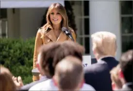  ?? ANDREW HARNIK — THE ASSOCIATED PRESS ?? First lady Melania Trump, accompanie­d by President Donald Trump, right, speaks on her “Be Best” initiative during an event in the Rose Garden of the White House, Monday, May 7 in Washington. Sixteen months into the president’s term, Melania Trump...