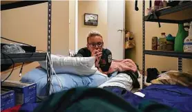  ??  ?? Emergency medical technician Caitlyn Rappe has been sleeping in a storage room at Acadian Ambulance service in the aftermath of Hurricane Ida.