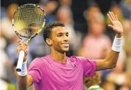  ?? GEORGIOS KEFALAS AP ?? Canada’s Felix Auger-aliassime cheers after winning his semifinal match against Spain’s Carlos Alcaraz at the Swiss Indoors in Basel, Switzerlan­d, on Saturday.