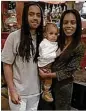  ?? CONTRIBUTE­D ?? Anthony Charles Hicks III with his parents, who are suing the apartment complex where he fell to his death July 4.