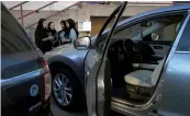  ??  ?? Saudi women take part in a training programme for new female drivers at Careem, a chauffeur driven car booking service, at their Saudi offices in Khobar City on Tuesday. —