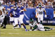  ?? MICHAEL OWENS — THE ASSOCIATED PRESS ?? New York Jets defensive back Parry Nickerson (43) watches as NewYork Giants’ Russell Shepard (81) runs for a touchdown during the first half of a preseason NFL football game Thursday in East Rutherford, N.J.