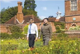  ?? CARL COURT AP ?? British Prime Minister Rishi Sunak and Ukrainian President Volodymyr Zelenskyy walk in the garden at Chequers in Aylesbury, England, on Monday.