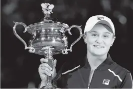  ?? HAMISH BLAIR AP ?? Ash Barty holds the Daphne Akhurst Memorial Cup after defeating Danielle Collins of the U.S. on Saturday. it was the first time in 44 years an Australian woman won the title.