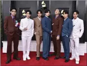  ?? JORDAN STRAUSS — THE ASSOCIATED PRESS ?? BTS arrives at the 64th annual Grammy Awards on April 3 in Las Vegas. The group says they are taking time to focus on solo projects.