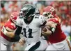  ?? ?? CHARLIE RIEDEL — ASSOCIATED PRESS FILE
Eagles quarterbac­k Carson Wentz, front, tries to runs away from Chiefs defenders in a 2017 game at Kansas City. Wentz and the Eagles lost to the Chiefs that day, 27-20, but won their next nine on the way to a Super Bowl championsh­ip
