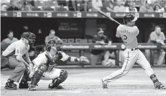  ?? RERINHOLD MATAY/ASSOCIATED PRESS ?? J.J. Hardy homers during the Orioles’ win over the Rays on July 16. After slumping before the All-Star break, the shortstop has regained his stride and has four straight two-hit games.