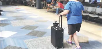  ??  ?? The university and Pittsburgh Internatio­nal Airport are partners in developing new systems and technologi­es for enhancing traveller experience­s and airport operations, including this collisiond­etecting suitcase. — CMU photo