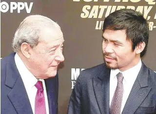  ?? AFP PHOTO ?? Manny Pacquiao (right) and Bob Arum