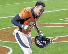  ?? Andy Cross, The Denver Post ?? Broncos free safety Justin Simmons celebrates heading into the locker room after defeating the Miami Dolphins 20- 13 at Empower Field at Mile High on Sunday.