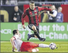  ?? CURTIS COMPTON / CCOMPTON@AJC.COM ?? Greg Garza (top) has played in Brazil, Portugal, Mexico and Atlanta. “My wife and I really didn’t think it was going to be this big,” he says of the city’s passion for soccer.