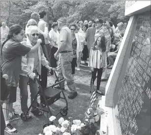  ?? Ernest A. Brown/The Call ?? Gloria Maciminio, sister of Marine Lance Corporal Antonio Maciminio, Jr., becomes emotional after reciting his name during during the 21 Heroes monument dedication ceremony at Slater Park in Pawtucket Sunday. Lance Corporal Maciminio was killed in...