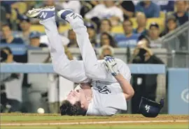  ?? Luis Sinco Los Angeles Times ?? A BUNT attempt didn’t go so well for Dodgers starter Rich Hill, who was struck by the ball in the fourth inning. He was able to return to the mound.