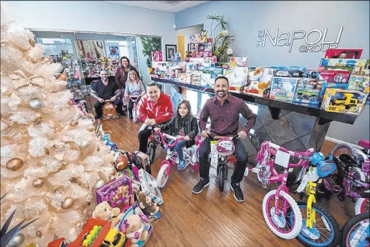  ?? Napoli Group ?? Frank Napoli II with Berkshire Hathaway Home Services fills his classic cars with toys for needy kids every holiday. This year marks his seventh annual toy drive.