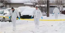  ?? GREG SOUTHAM ?? Edmonton police investigat­e the surroundin­g area near an apartment at 79 Avenue and 71 Street Thursday where the bodies of two children were found.