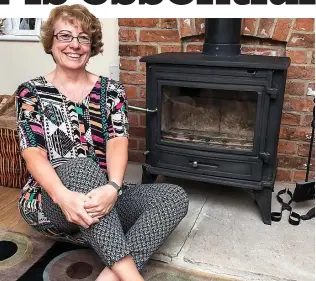  ??  ?? Warmth: Country dweller Donna Langley depends on her wood burner