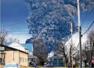  ?? GENE J. PUSKAR / AP ?? A large plume of smoke rises over East Palestine, Ohio, on Feb. 6 after a controlled detonation of a portion of the derailed Norfolk Southern trains. The derailment happened on Feb. 3.