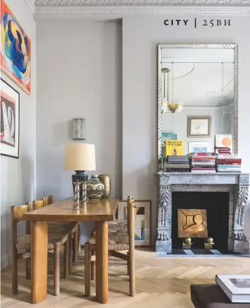  ??  ?? DINING AREA A mid-century dining table by Charlotte Perriand defines the dining zone in a corner of the sitting room.