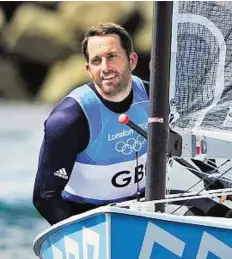  ??  ?? Sailing into record books Ben Ainslie of Great Britain celebrates after winning the men’s finn class in Weymouth on Sunday.
EPA