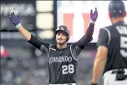  ?? Aaron Ontiveroz / THE DENVER POST ?? Nolan Arenado (28) of the Colorado Rockies raises his arms after hitting two-run single in the bottom of the sixth inning against the Los Angeles Dodgers at Coors Field on Monday, July 29, 2018.