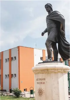  ??  ?? The monument of king Alexander III of Macedon in front of a school named king Alexander III of Macedon in Skopje.