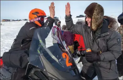  ?? Photo by James Mason ?? HIGH FIVES – Ethan Kelso gets an enthusiast­ic high five from a fan after finishing.