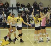  ?? John Stevens/appeal Democrat ?? Maddy Kunkle (back right) and her teammates celebrate after a block by Erin Peak in the first set of their match against Lassen.