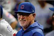  ?? ASSOCIATED PRESS ?? IN THIS SEPT. 25, 2019, FILE PHOTO, then-Chicago Cubs manager Joe Maddon stands in the dugout before a game against the Pittsburgh Pirates, in Pittsburgh. Joe Maddon has agreed to become the Los Angeles Angels’ manager. Maddon and the Angels agreed to terms on Wendesay, on a deal to reunite the veteran manager with the organizati­on where he spent the first three decades of his baseball career.