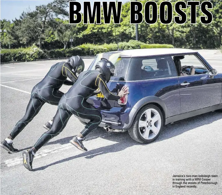  ??  ?? Jamaica’s two-man bobsleigh team in training with a MINI Cooper through the streets of Peterborou­gh in England recently.